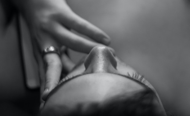 woman with hand on her face