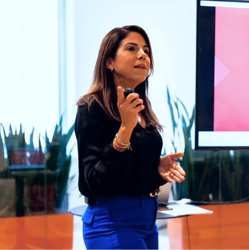 Brunette woman presenting on workplace diversity training