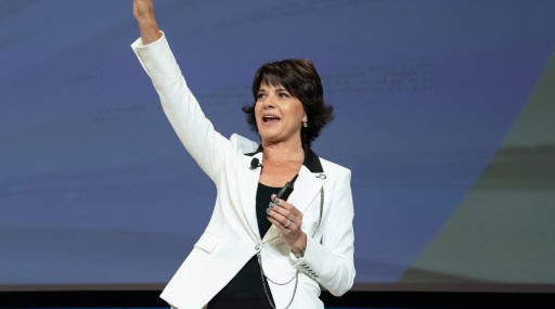 Female motivational speakers in a white blazer