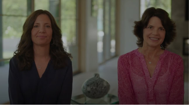 Two woman sitting together in a house to discuss a leadership development program