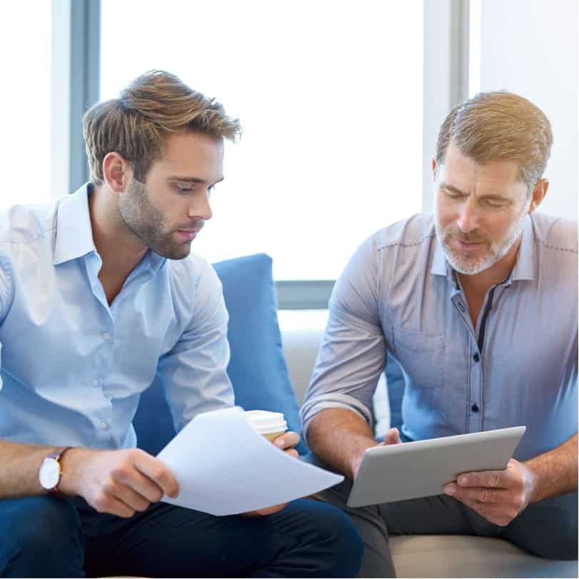 2 business men discussing professional development for finance industry